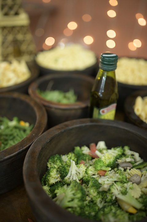 Fresh salad and ingredient bowls at a live counter