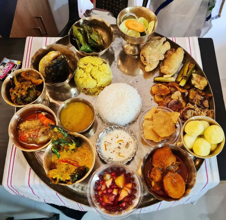 Bengali thali spread with rice, dal, fish and sides